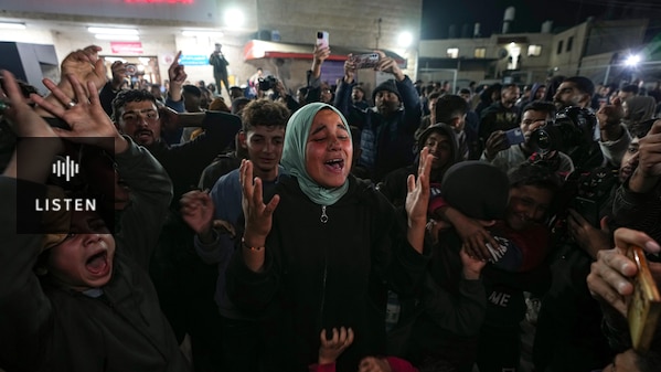 People celebrate in the streets looking happy . Has Audio.