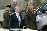 US Defence Secretary James Mattis (C) and Joint Chiefs Chairman General Joseph Dunford (R) depart after the Senate briefing.