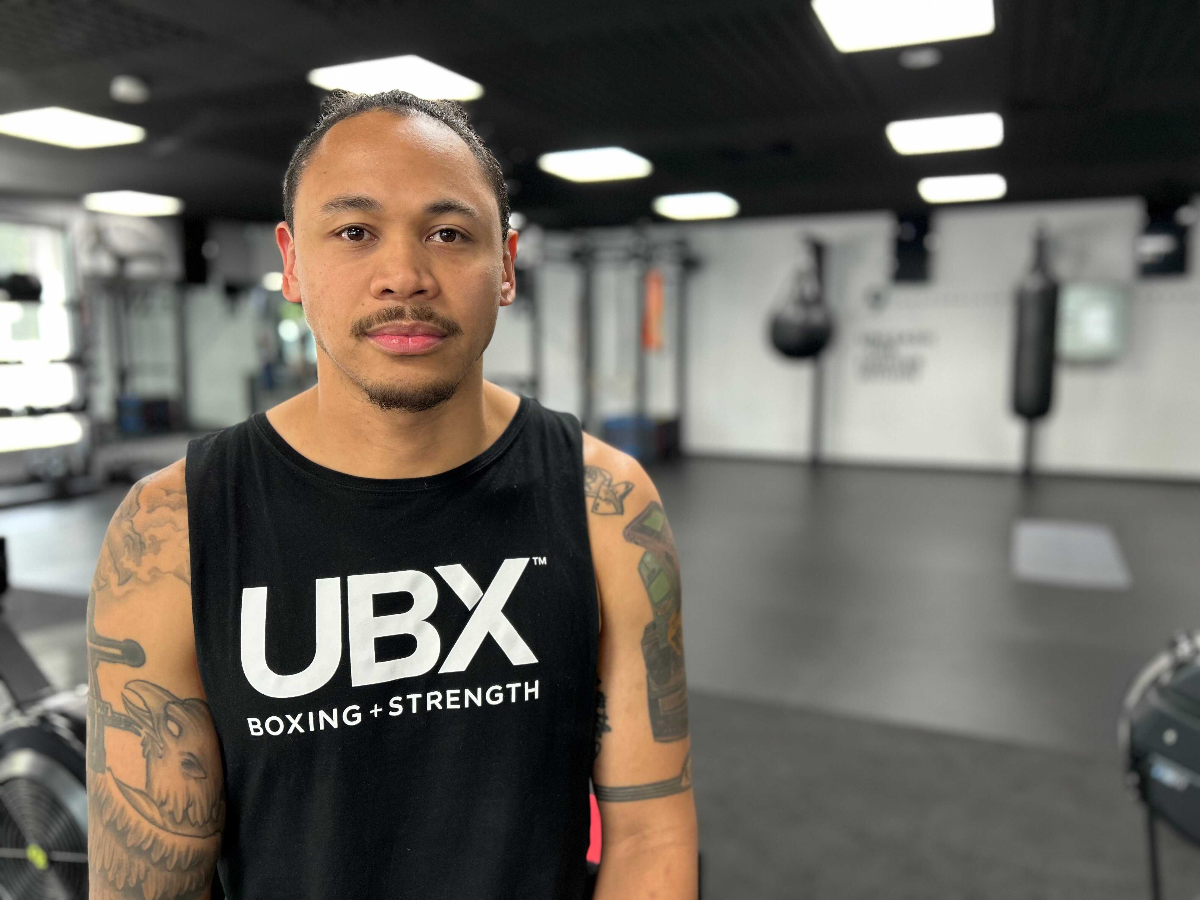 Christopher Murphy standing in his boxing gym.