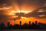 Orange clouds over the Sydney skyline.