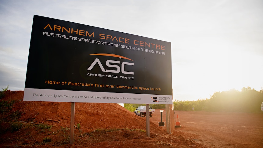 Sign in red dirt reading Arnhem Space Centre. 