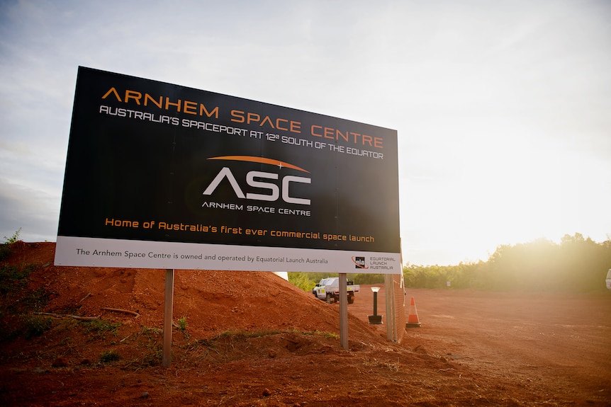 Sign in red dirt reading Arnhem Space Centre. 