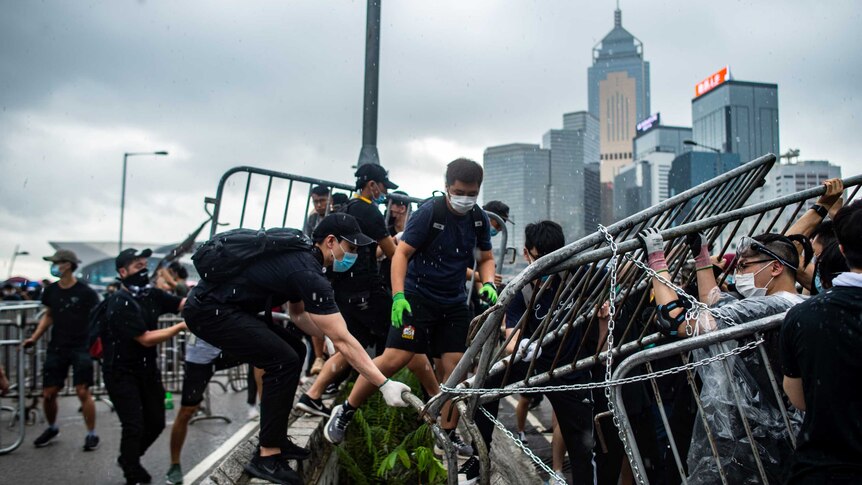 Protesters occupy two main highways near the government headquarters in Hong Kong.