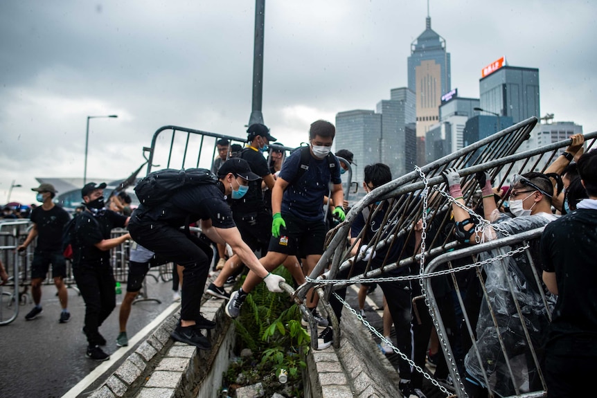 Protesters occupy two main highways near the government headquarters in Hong Kong.