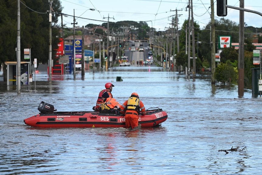 SES boat in a flooded street in Maribyrnong.