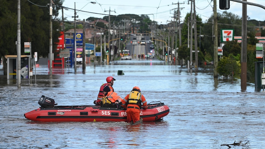 SES boat in a flooded street in Maribyrnong.