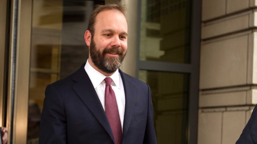 Rick Gates casts his eyes downwards.