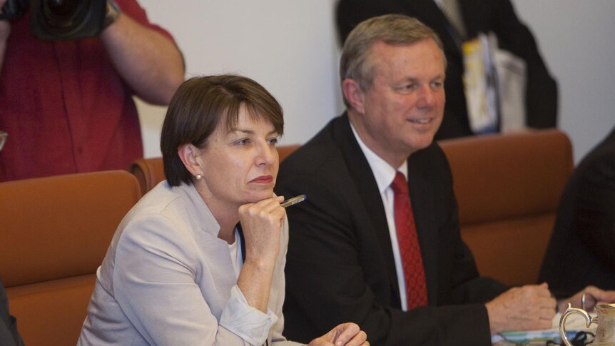 Queensland Premier Anna Bligh and South Australian Premier Mike Rann sit together during the annual