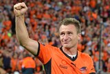 Brisbane's Besart Berisha thanks the fans as he goes up to receive his grand final winner's medal.