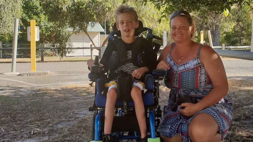 Crystie Oatley with her son Zac, 10 in his wheelchair