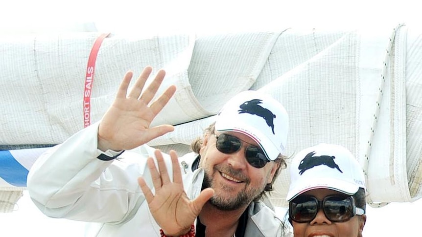 Russell Crowe and Oprah Winfrey wave to the crowds