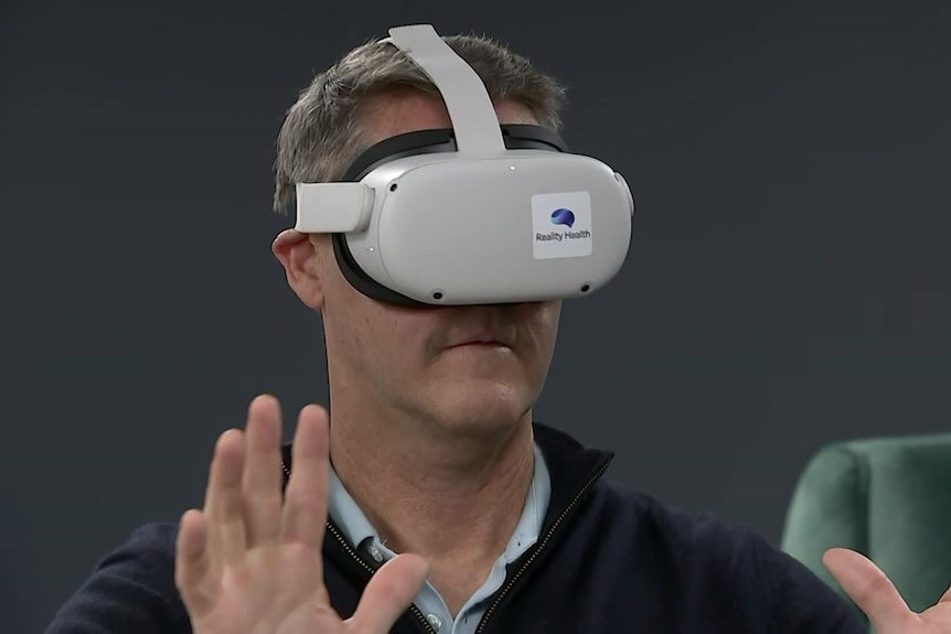 A man wears a VR headset.