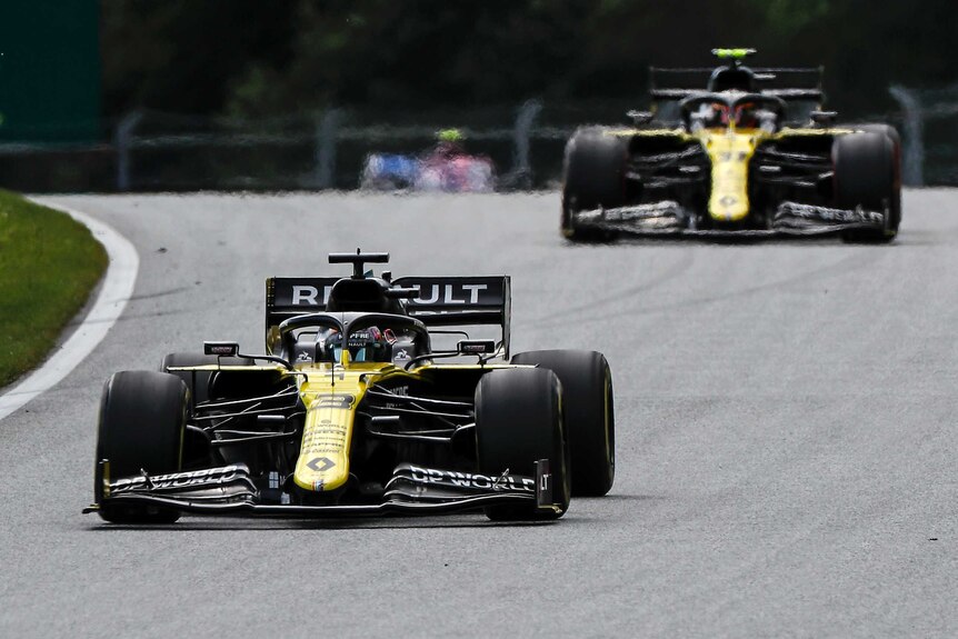 Daniel Ricciardo's Renault car drives ahead of his teammate Esteban Ocon