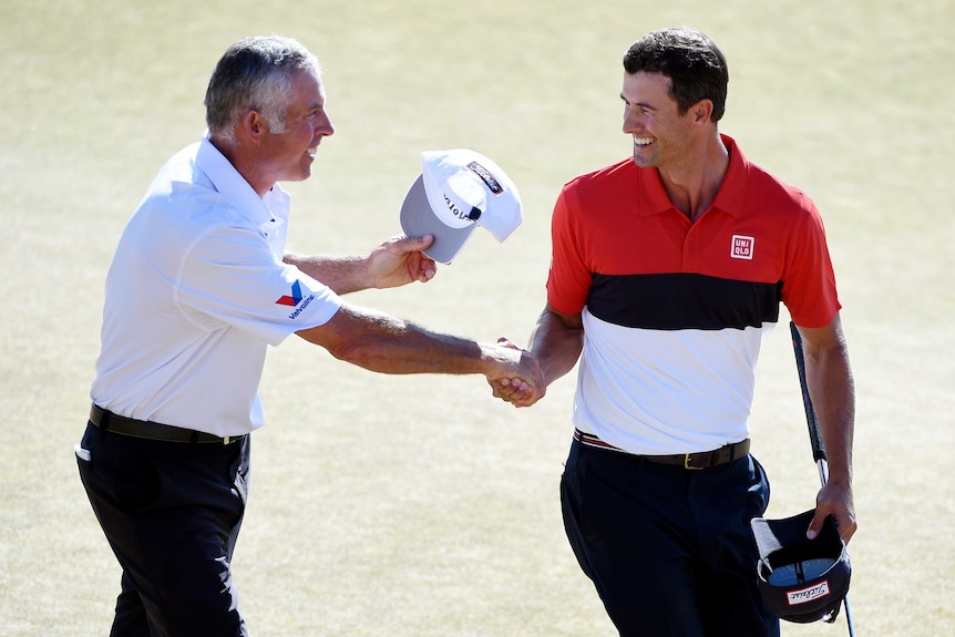 Adam Scott celebrates with caddie Steve Williams after the final round of the 2015 US Open.