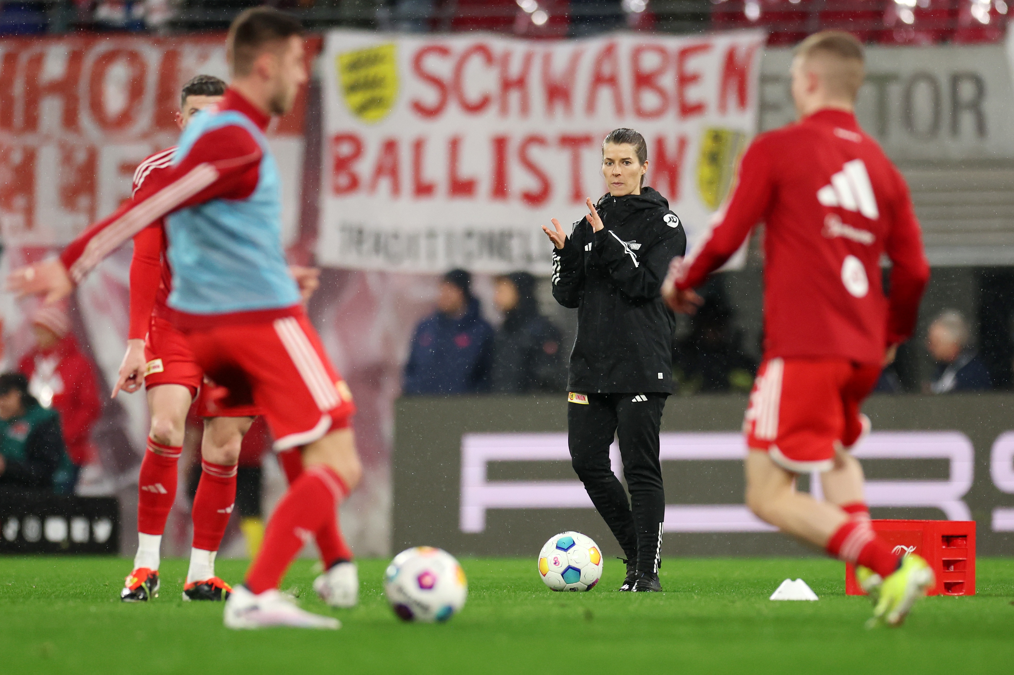 Marie Louise Eta claps her players