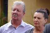 Ray and Margaret Dodd look solemn at Labor's press conference on "no body, no parole" laws.