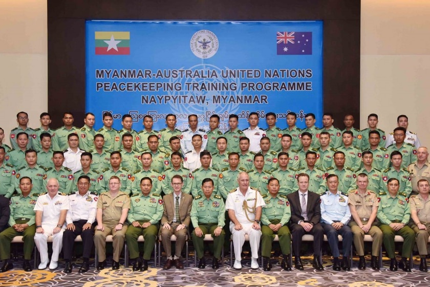 Australian and Myanmar officials pose for an official photograph in Naypyidaw, Myanmar.