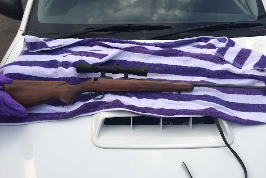 A rifle, with sight, put on display after it was recovered by NT Police.