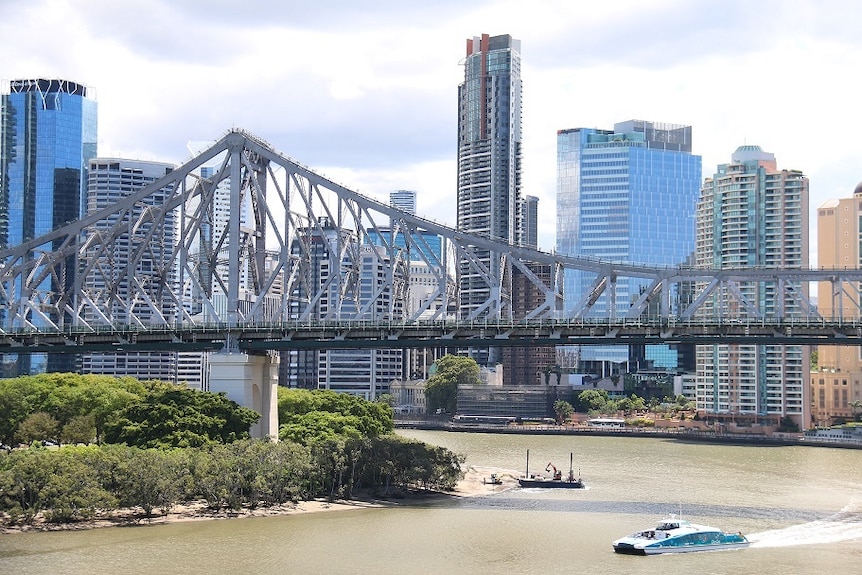 A CityCat crosses the Brisbane River underneath the Story Bridge