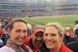 Lisa Millar with friends at a baseball game in the US.