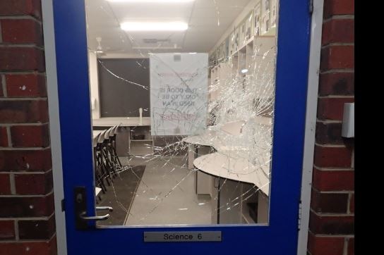 A door with window panes smashed.