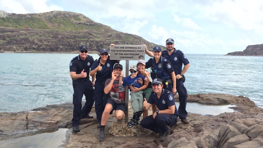 Sidney Cook, his mum, Narelle, and dad, Gary, with officers from Bamaga police station at the northernmost tip of Australia.