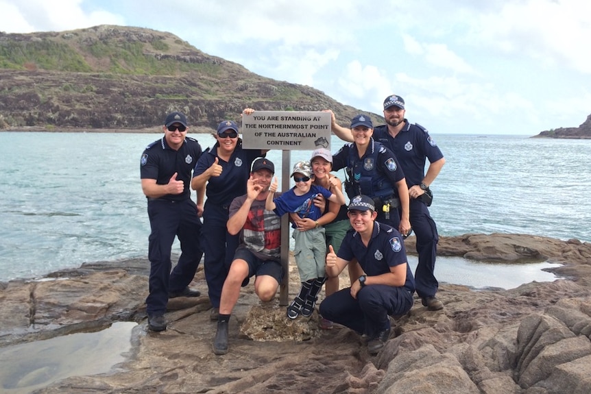 Sidney Cook, his mum, Narelle, and dad, Gary, with officers from Bamaga police station at the northernmost tip of Australia.