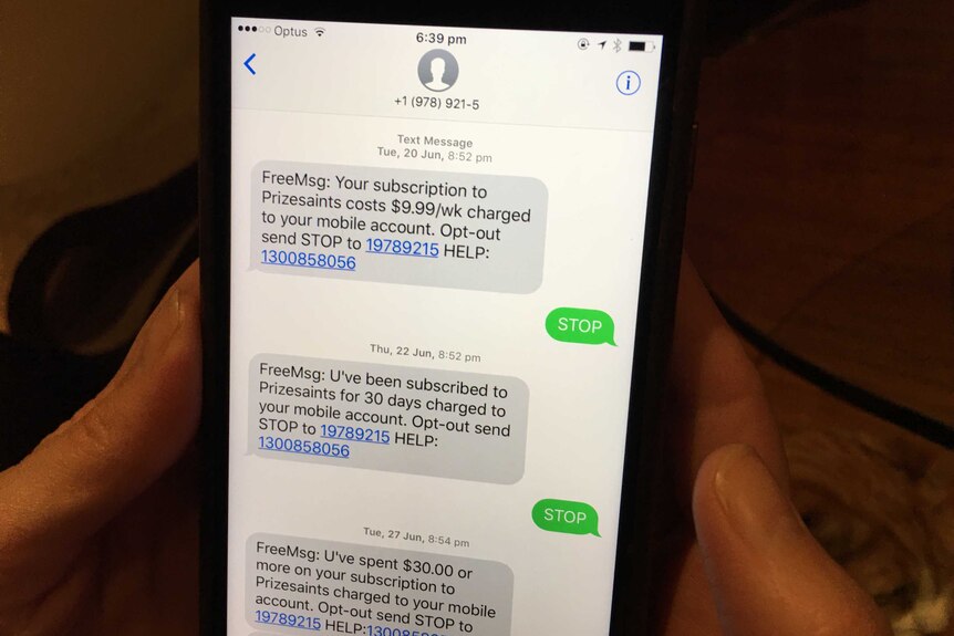 Opt-out message on a phone being held in the dark