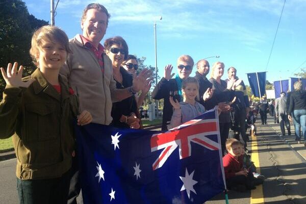 Crowds line St Kilda Road for the parade