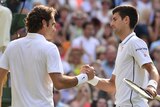 Serbia's Novak Djokovic (R) shakes hands with Swiss Roger Federer after winning Wimbledon in 2014.