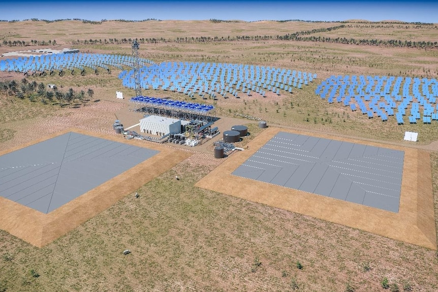 panoramic shot of a solar and hydro energy farm with solar panels and large grey storage areas 