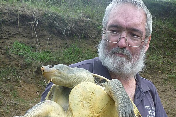 Man holding a turtle
