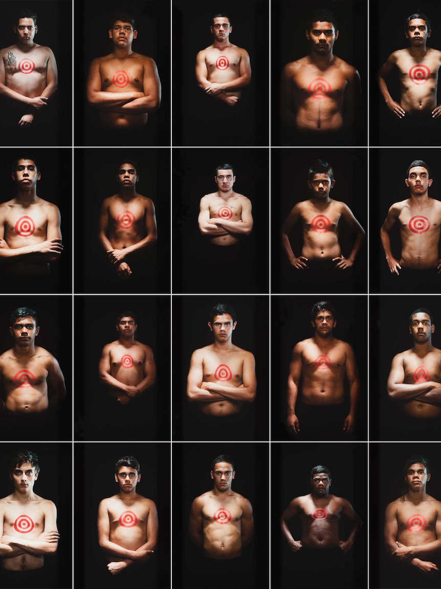 Tony Albert's winning work We Can Be Heroes, a grid of photos of Aborginal men with red targets painted on their chests.