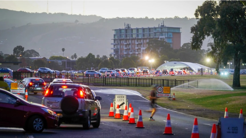 A long car queue outside the Victoria Park drive-through clinic.