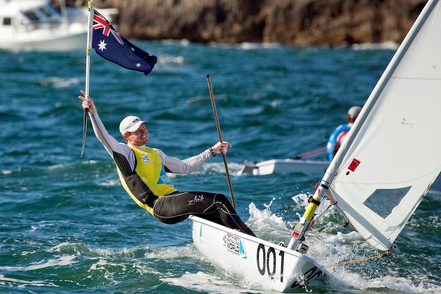 Tom Slingsby celebrates winning the gold medal at the ISAF Sailing World Championships.