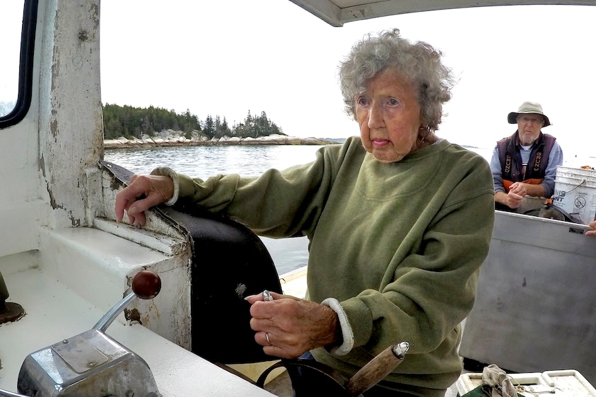 Lobster woman pilots a ship.