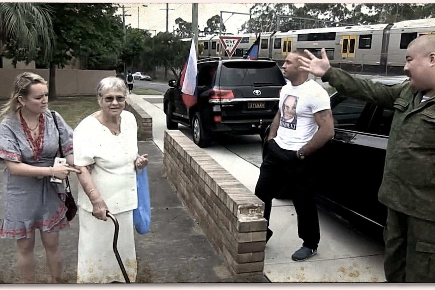 Boikov (far right) was filmed taunting parishioners and their priest outside a Ukrainian church in Sydney.