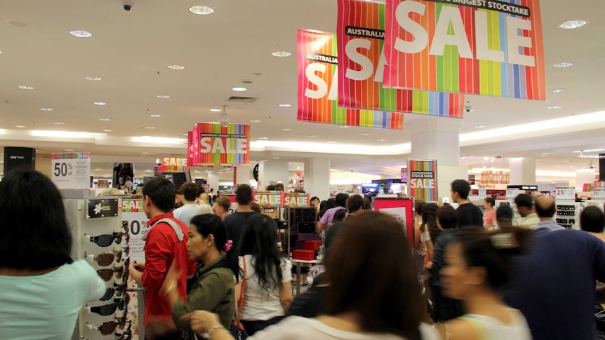 Shoppers enter the Brisbane Myer store at the start of the Boxing Day sale