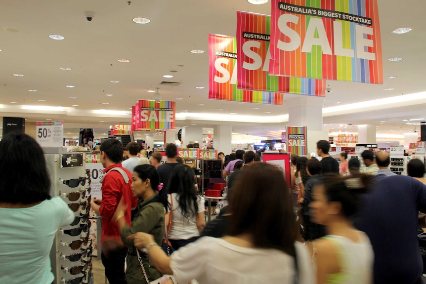 Shoppers enter the Brisbane Myer store at the start of the Boxing Day sales.