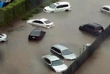 Cars submerged in water outside the Traffic Accident Commission in Geelong.