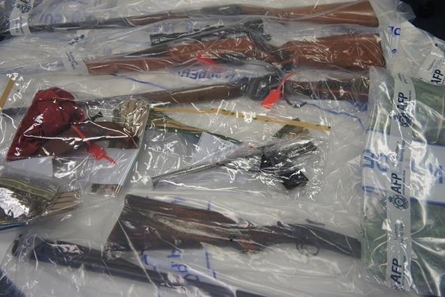 The guns were seized during simultaneous raids in Canberra's south.