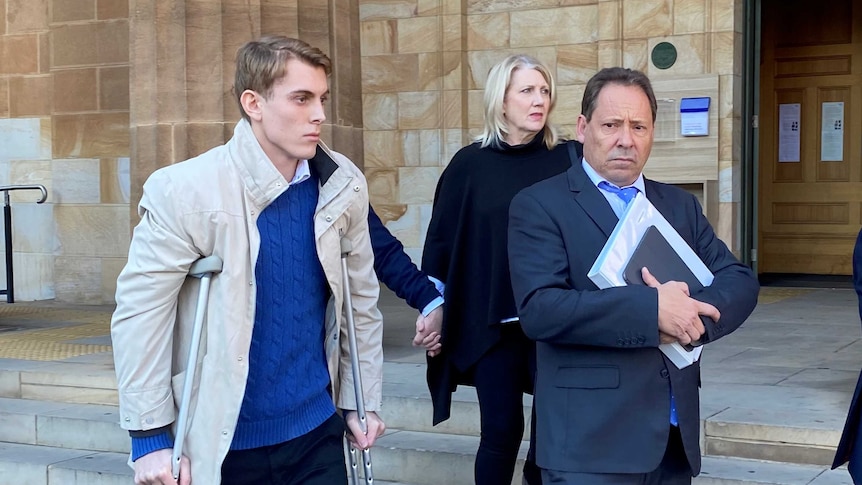 Charged driver Harrison Kitt and others outside an Adelaide court.