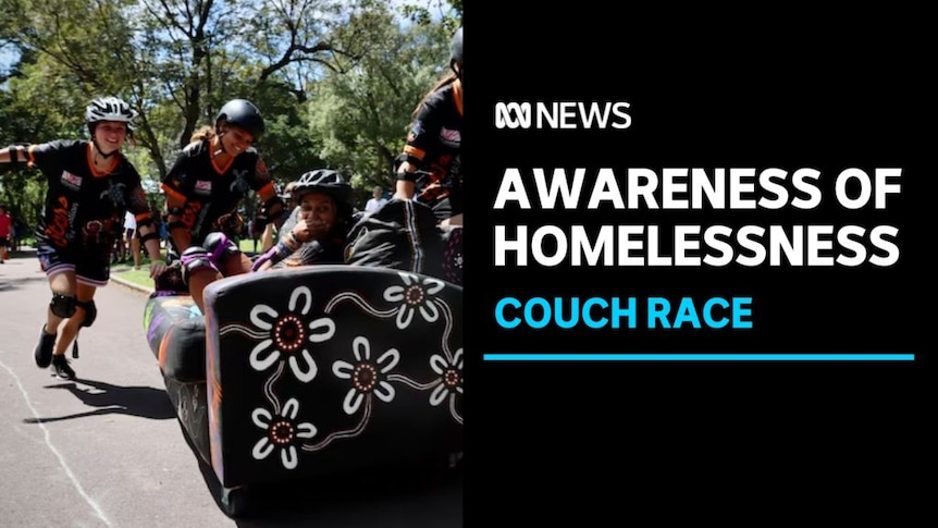 Awareness of Homelessness, Couch race: Three kids wearing helmets push a couch down the street while another kid lies on it.