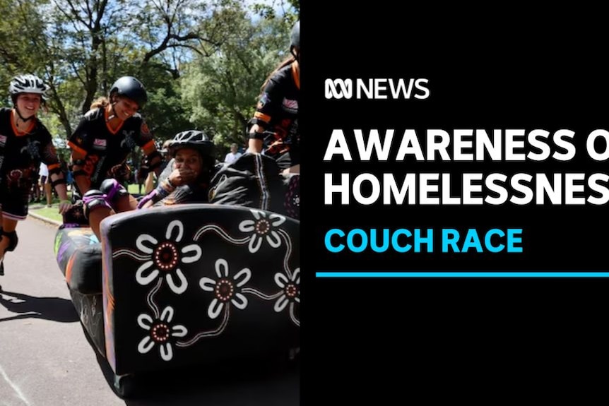 Awareness of Homelessness, Couch race: Three kids wearing helmets push a couch down the street while another kid lies on it.
