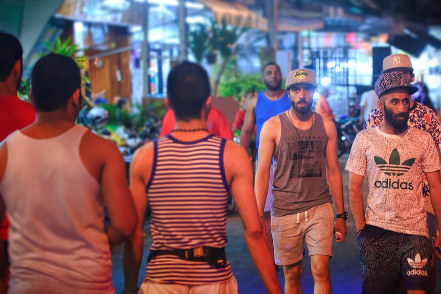 Middle Eastern men walking