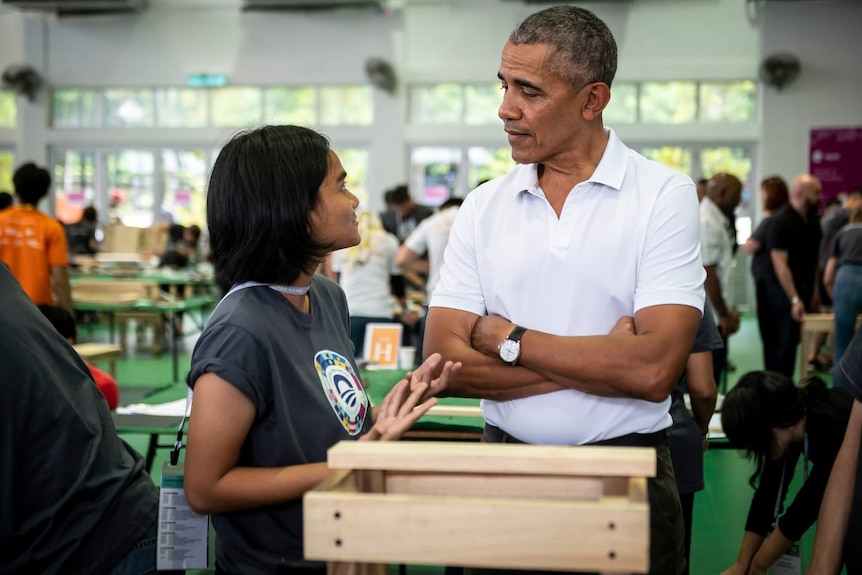 A woman talking to a man