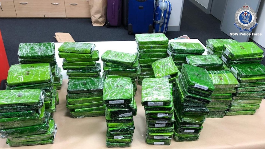 Piles of green blocks wrapped in plastic.