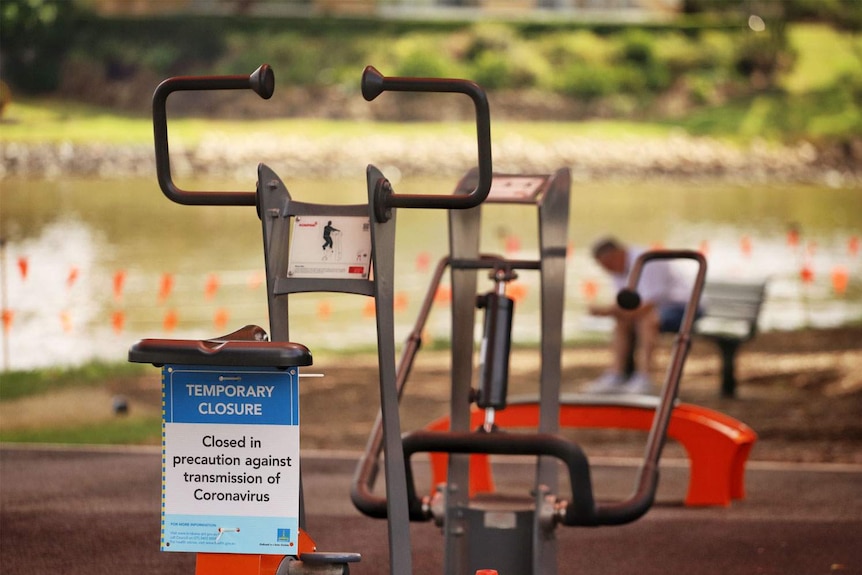 Closed sign on gym equipment at Brisbane's South Bank parklands.