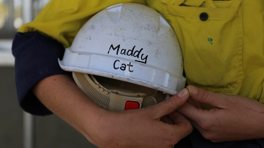 Hard hat that says 'Maddy Cat'