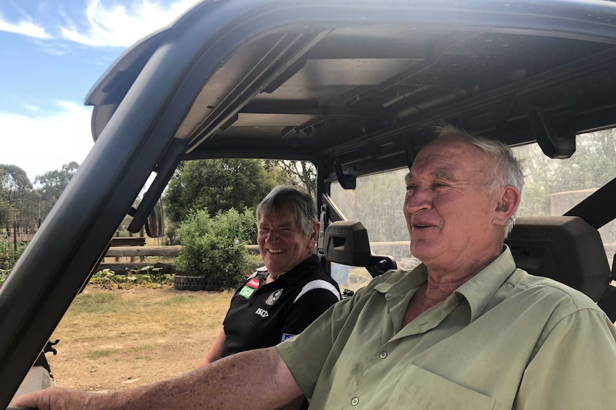 Two men pictured in a vehicle in the Victorian countryside.